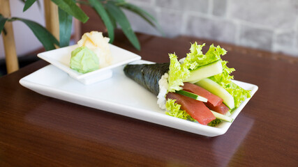 Tuna temaki sushi. Temaki is a very popular cone stuffed with rice and fish in Japan.
