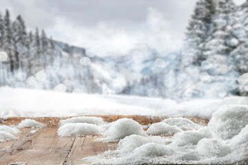 Winter wooden table on a frosty day with snow and free space