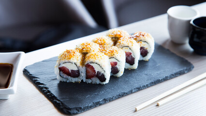 Tuna uramaki with strawberry in Japanese restaurant. 