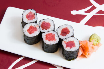 Tuna maki in Japanese restaurant. Combination of fish and rice covered with seaweed.