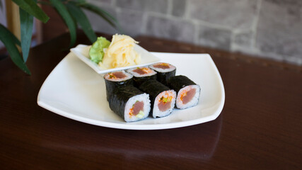 Tuna maki in Japanese restaurant. Combination of fish and rice covered with seaweed.