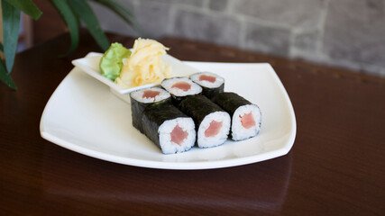 Tuna maki in Japanese restaurant. Combination of fish and rice covered with seaweed.
