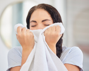Woman, smell towel or laundry with fresh fabric, clean cloth and hospitality work in hotel, home or...