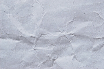 White wrinkled paper texture, a sheet of recycled white paper as background
