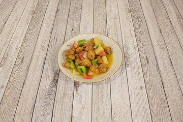 Sweet and sour pork is a traditional dish of Chinese cuisine that has become particularly international due to its existence on the menus of Chinese restaurants in the Western world