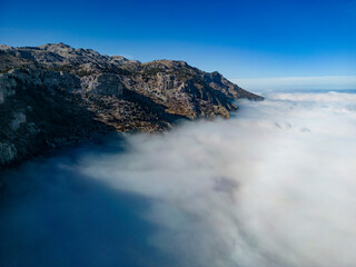 Fototapeta na wymiar foggy aerial views at the top of enormous mountains