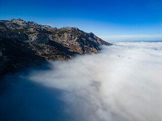 foggy aerial views at the top of enormous mountains