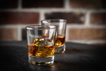 Whiskey with ice in glasses