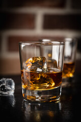 Whiskey with ice in glasses