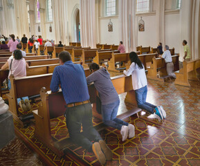 People praying in Catholic  Church in Costa Rica. 