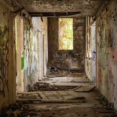 Fototapeta na wymiar Vandalised passageway inside an abandoned residential block