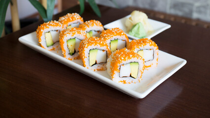 Vegan uramaki. Type of sushi covered with rice on the outside and filled with a combination of vegetables.