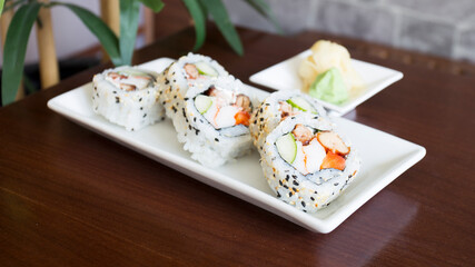 Vegan uramaki. Type of sushi covered with rice on the outside and filled with a combination of vegetables.