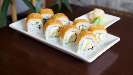 Vegan uramaki. Type of sushi covered with rice on the outside and filled with a combination of vegetables.