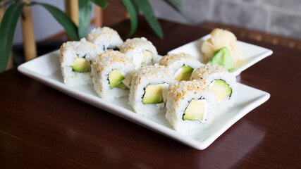 Vegan uramaki. Type of sushi covered with rice on the outside and filled with a combination of vegetables. © Leckerstudio