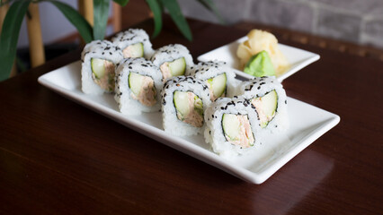 Vegan uramaki. Type of sushi covered with rice on the outside and filled with a combination of vegetables.