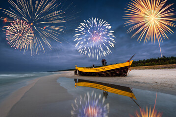 Happy New Year fireworks over Baltic Sea on the beach on Poland, Europe - obrazy, fototapety, plakaty