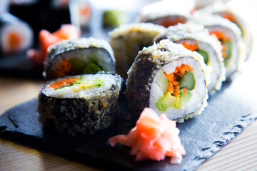 Vegan sushi hot roll. Sushi roll filled with vegetables and fried.