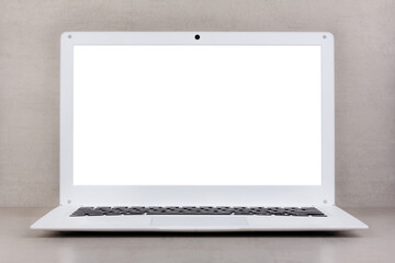 white mock up on a laptop screen on a gray background close-up front view