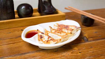 Japanese gyoza. Rice pasta dumplings stuffed with meat, fish or vegetables. They are cooked on the grill or fried.