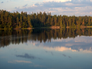 Fototapeta na wymiar reflections on a forest lake