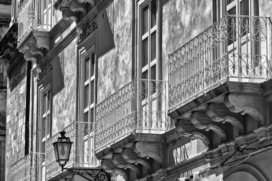 Fototapeta Facade of a residential building with balconies and decorative facade  Syracuse, Sicily, Ortigia, Italy