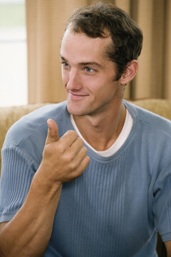 View of a young man communicating in sign language