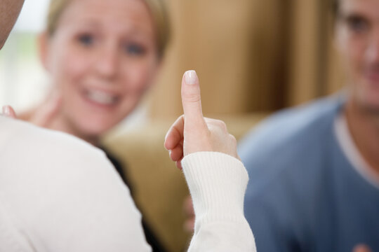 Close Up Of A Woman's Thumb Using Sign Language