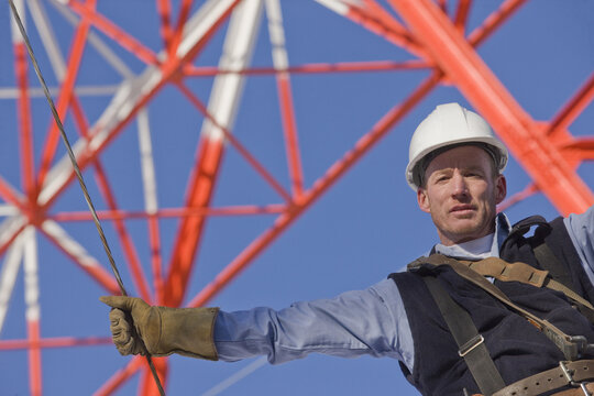 Low Angle View Of A Cable Lineman