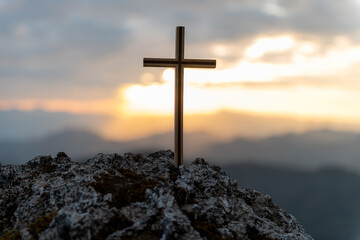 Symbol of God love to people the mountain at sunset