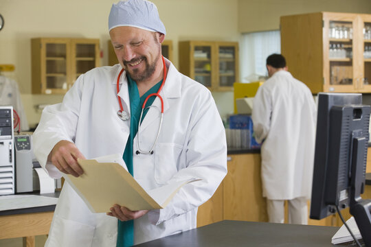 Scientist examining a record