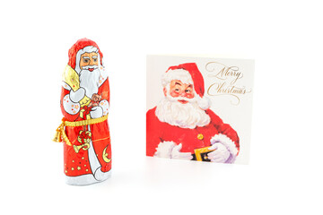 Chocolate Santa with Christmas card in background