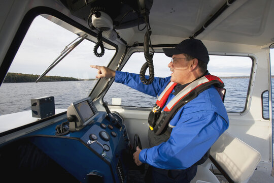 Security guard controlling a boat