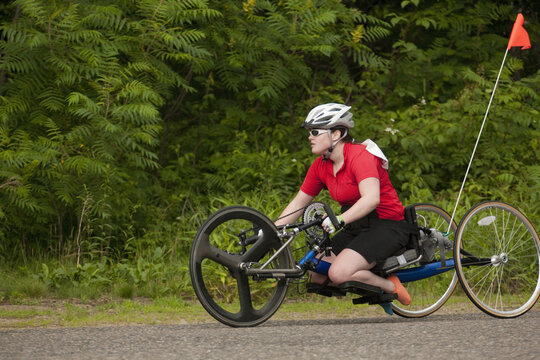 Woman with degenerative hip participating in a handcycle race