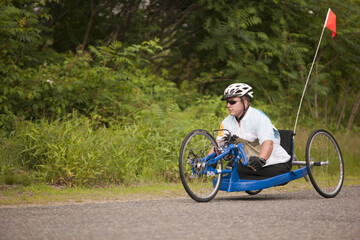 Man with disability participating in a handcycle race