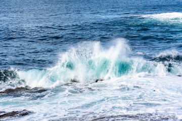 waves crashing against the rocks in the atlantic ocean in the town of Baiona, Galicia, Spain