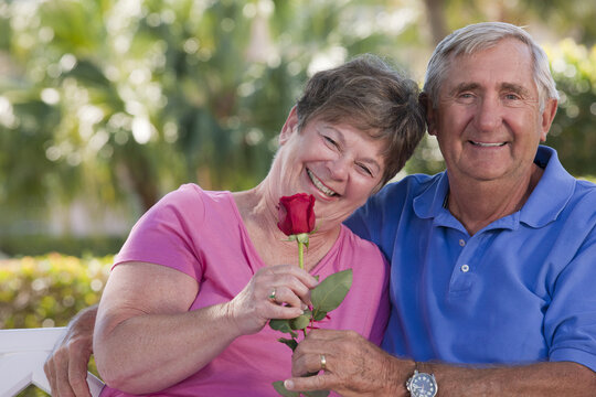 Senior couple smiling romantically