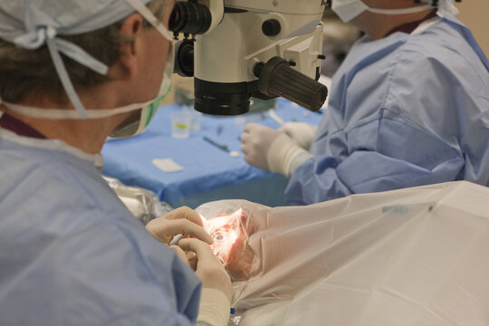 Doctor inserting viscoelastic into the eye of patient