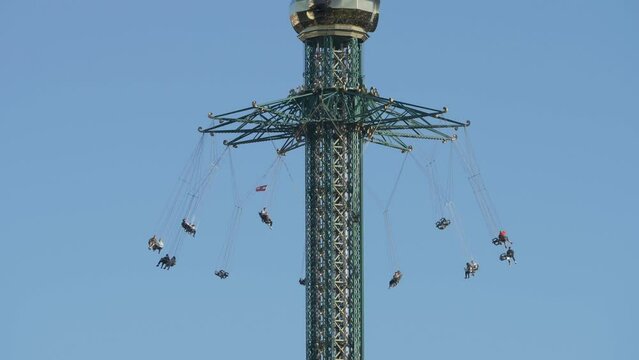 Sky flying chairs swinger spinning in the amusement park