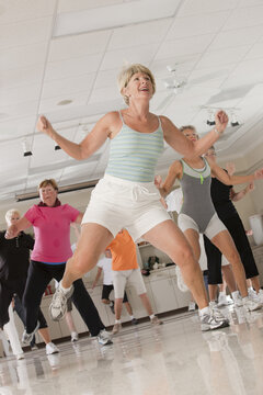 Senior exercise class doing stretches and cardio