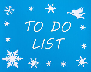 Naklejka na ściany i meble New Year's motivational card. Text TO DO LIST on a blue background with Christmas snowflakes, a white angel