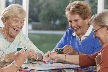 Senior women playing cards