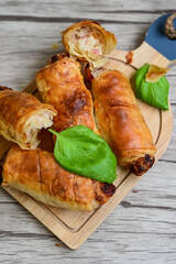  Greek style Mini filo pastry rolls with bacon and cheddar cheese .Home made bakery .Fresh baked  Mini cheese  ,meat and herbs puff pastries