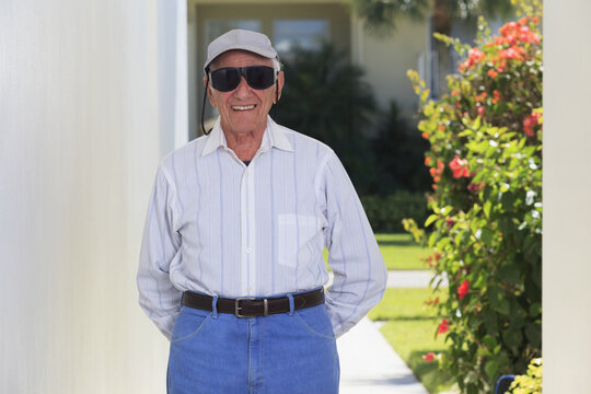 Senior man wearing Glaucoma glasses and smiling