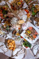 top view of the festive table with various dishes and snacks