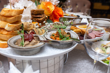 festive table in the restaurant with various dishes