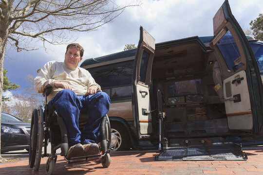 Man with Spinal Cord Injury opening his accessible van remotely