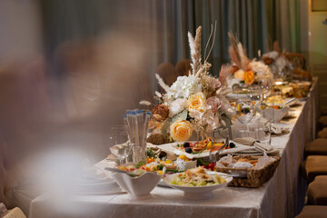 various dishes and snacks on the buffet table at the celebration