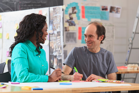 Engineering instructor with Aspergers demonstrating technical material with student in ideation lab