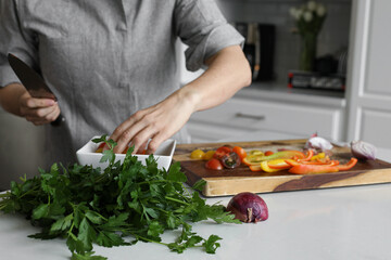 Prepping vegetables with parsley and tomatoes
